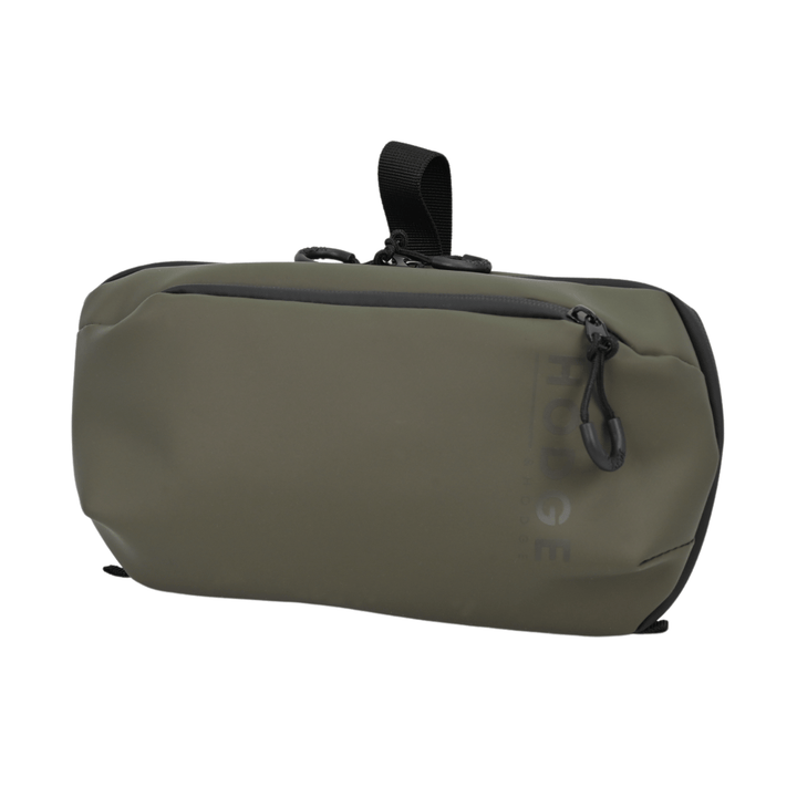 side view of hodge and hodge travel wash bag with front pocket and one main compartment, black hanging loop to the back
