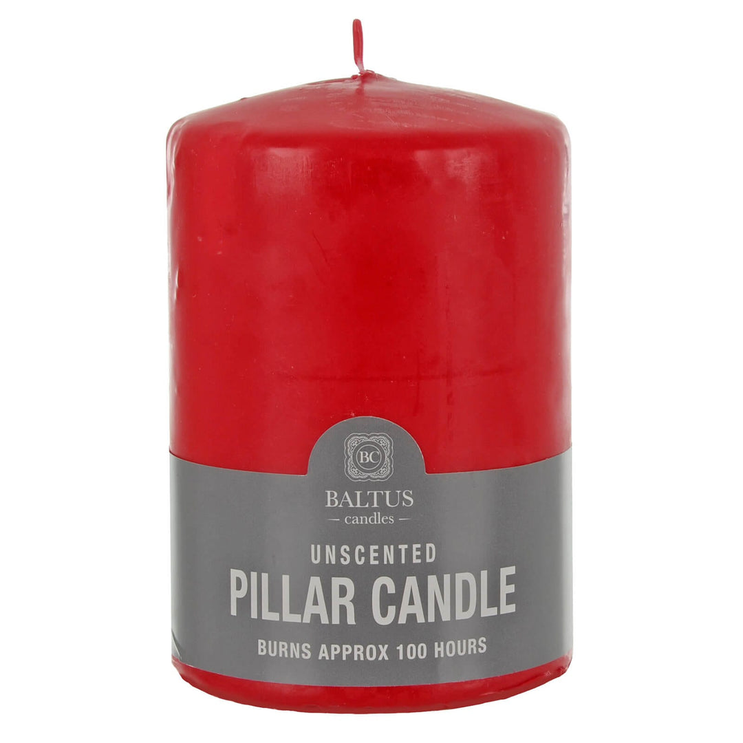 Red pillar candle with a gray label on a white background