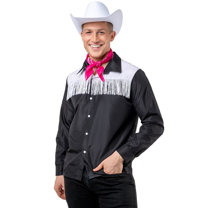 Man Wearing Balck and White frindged cowboy shirt ina relaxed posed and White Cowboy hat and Pink Neckerchief