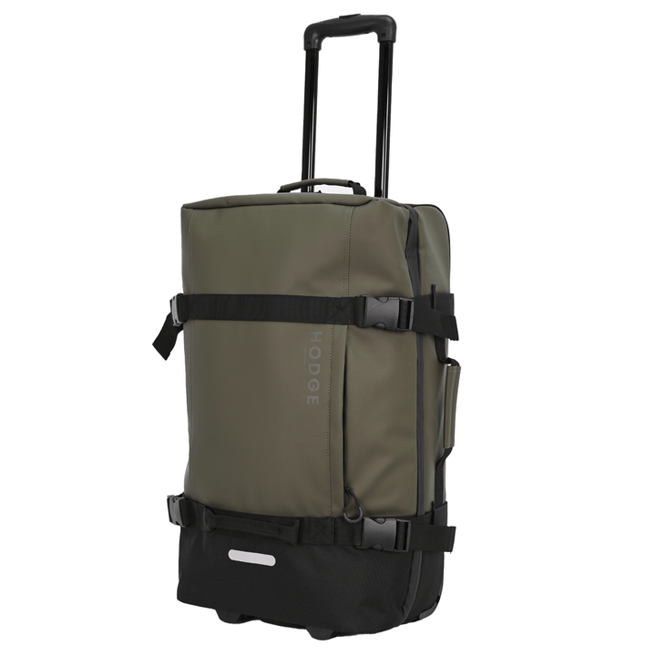 side view of medium hodge and hodge safari suitcase with telescopic handle, rounded zip pulls and stylish security buckles