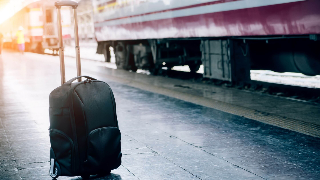 business laptop bag with extendable handle at train station