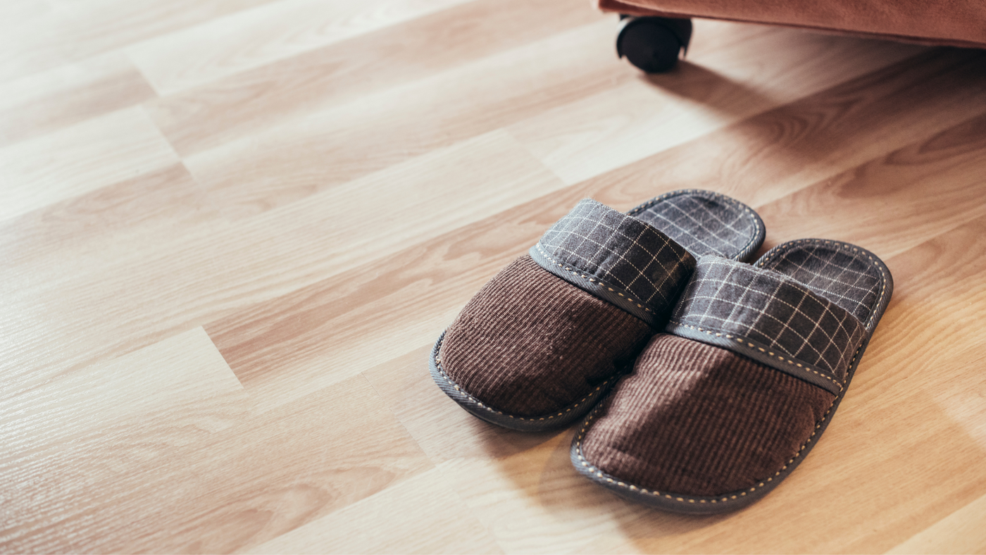 mens brown mule slippers on wooden floor 