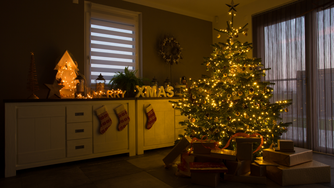 christmas tree with warm white lights and unit decorated with light up christmas ornaments
