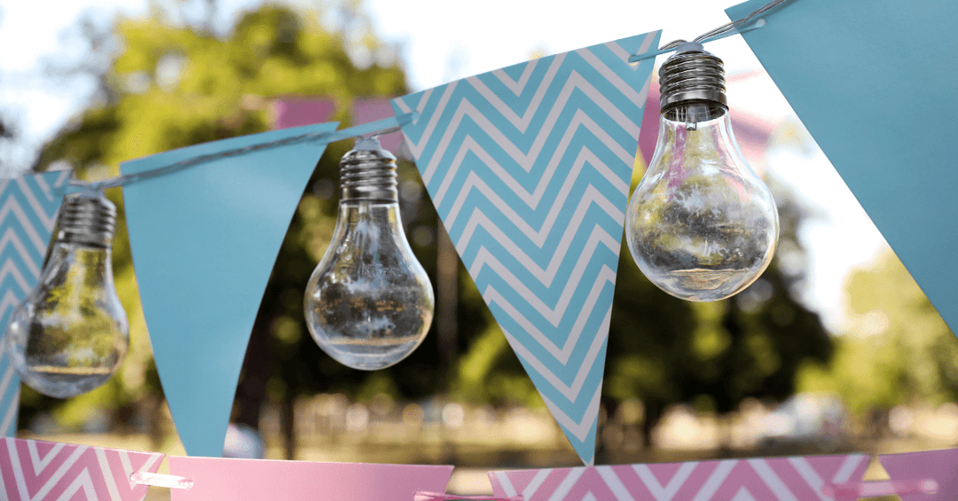 blue striped bunting hanging in outdoor space beside festoon party lights