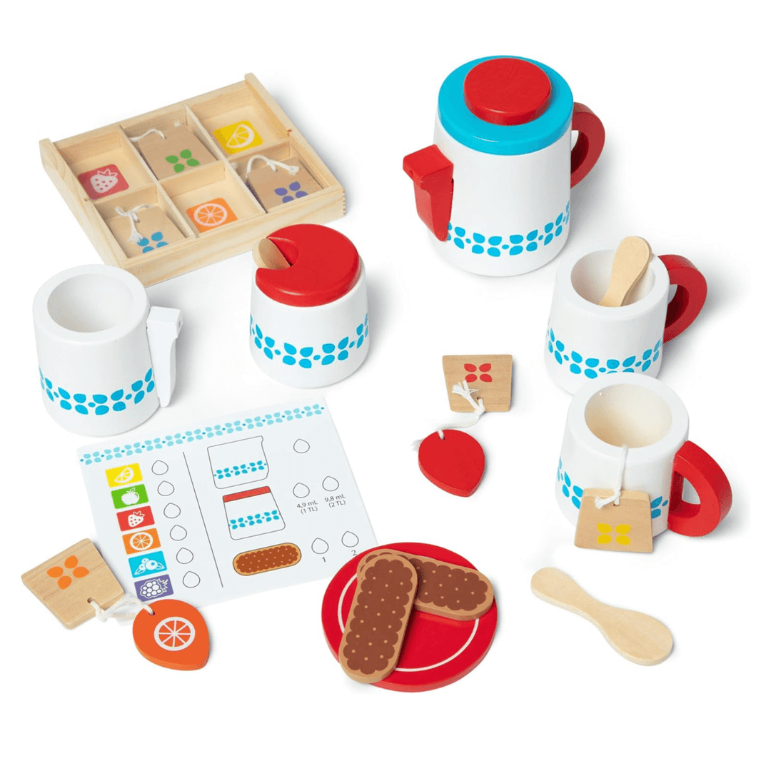 full tea set on white background without serving tray, including milk jug, wooden spoons and wooden teabags in strawberry and orange