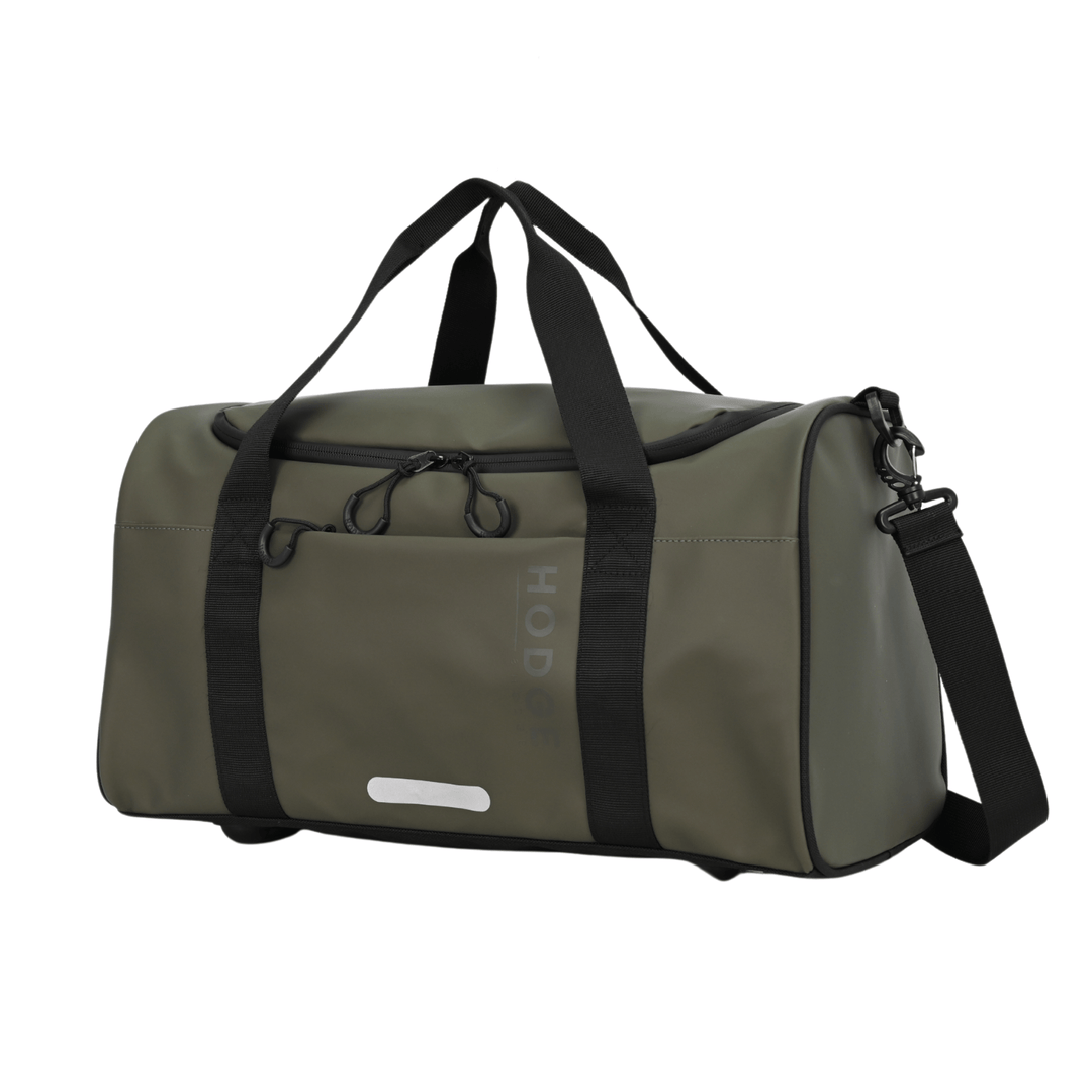 side view of olive green hodge and hodhe duffle bag with black carry handles and reflective details on the front 