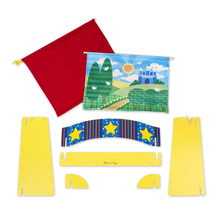 contents of the box unassembled including velvet curtain, reversible backdrop and wooden sections to create theatre stage