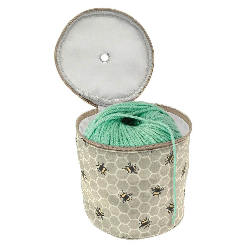 Bumblebee and honeycomb pattern knitting wool holder bag open to show a ball of wool inside