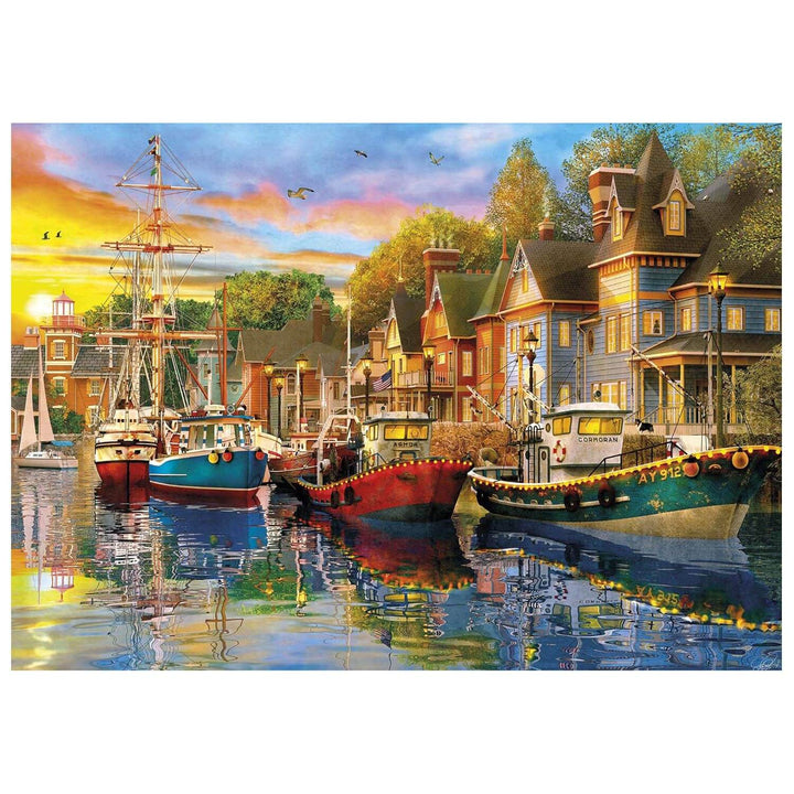 Sunset over water with fishing boats and yachts