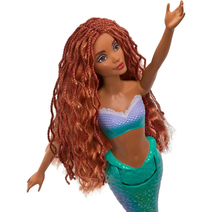 Close up of Ariel mermaid doll with long red hair