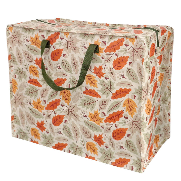 Storage bag with autumn leaf pattern and green handles on a white background