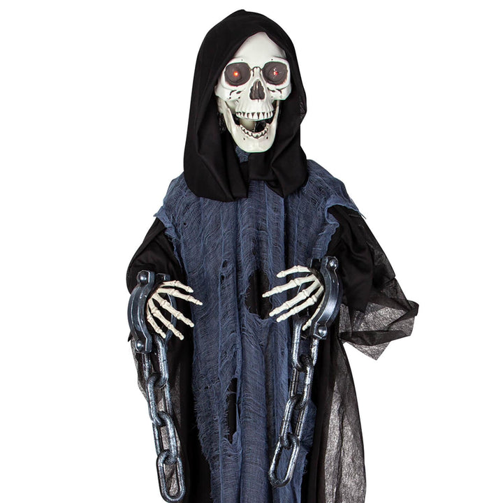 Close up of a Halloween animated hanging reaper figure in chains