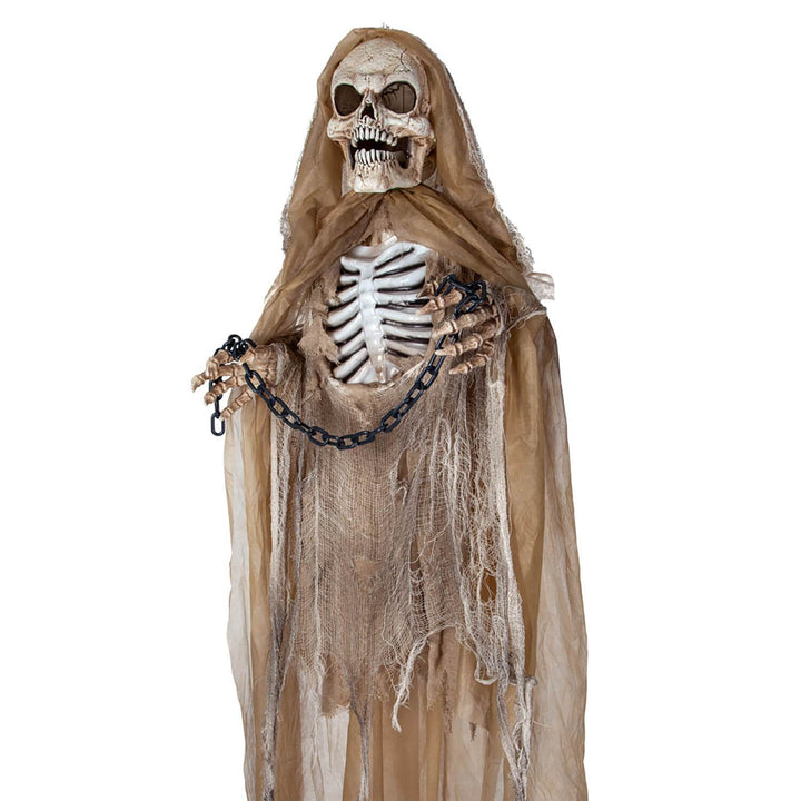 Close up of a hanging Skeleton with hands in chains for Halloween
