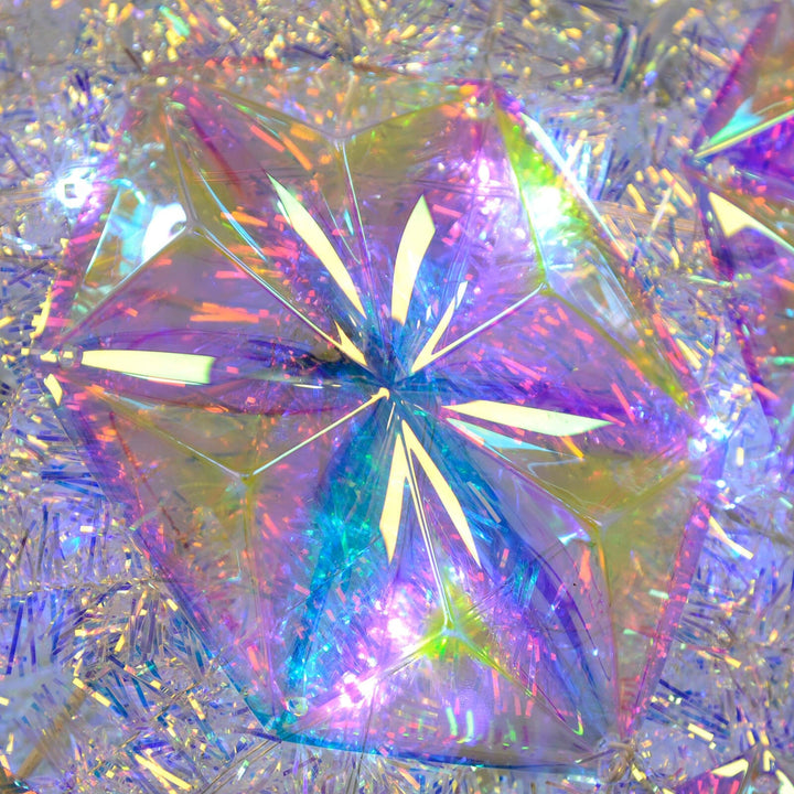 Close up of geometric panel shape on a light up tinsel star Christmas decoration
