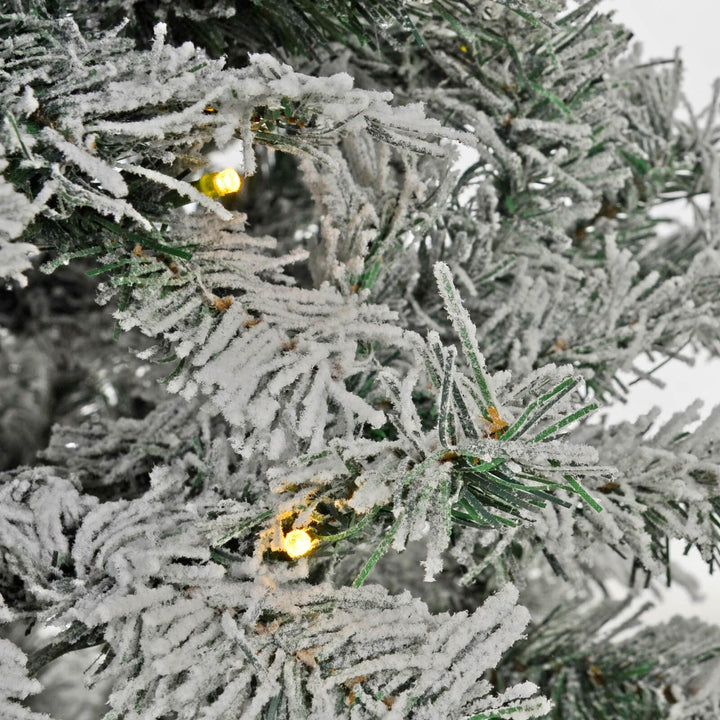 Close up of warm white LEd lights on a Frosted Christmas tree