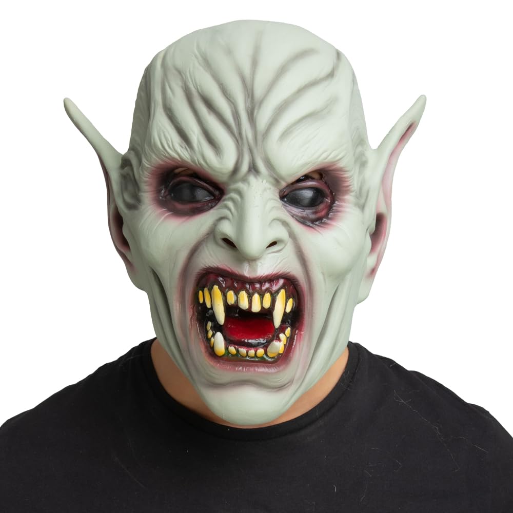 Person wearing a demon Halloween mask with pointed ears and a black shirt on a white background