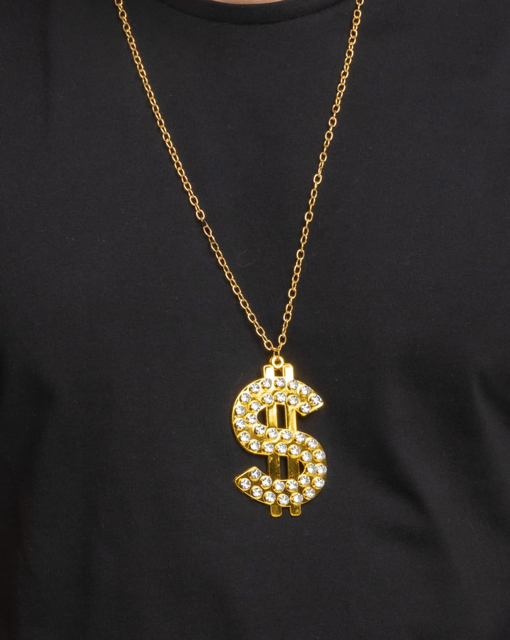 Gold necklace with a dollar sign pendant on a black background