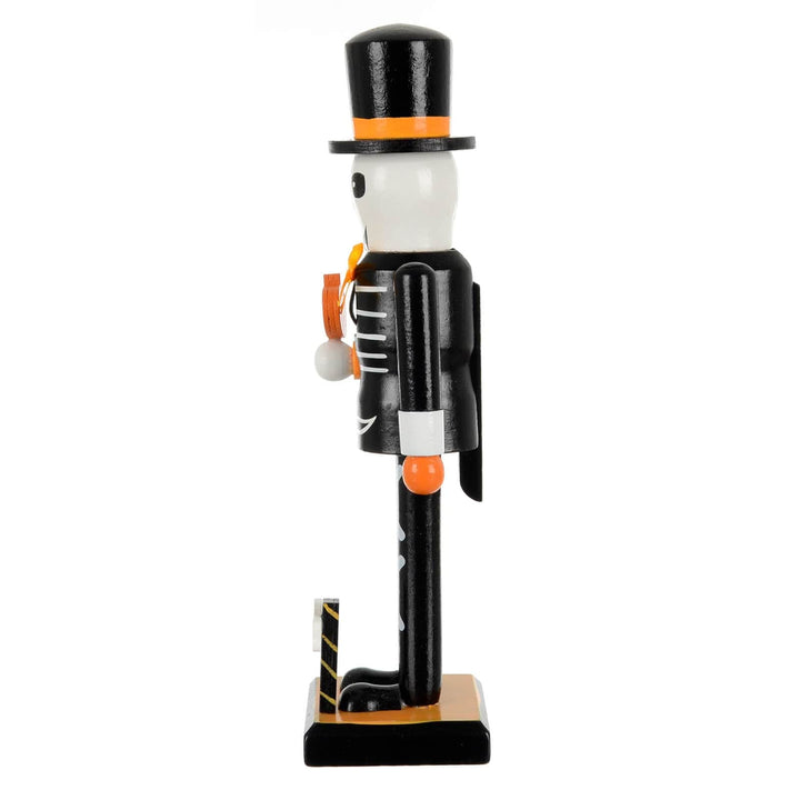  Side view of a black and white Skeleton figure with top hat