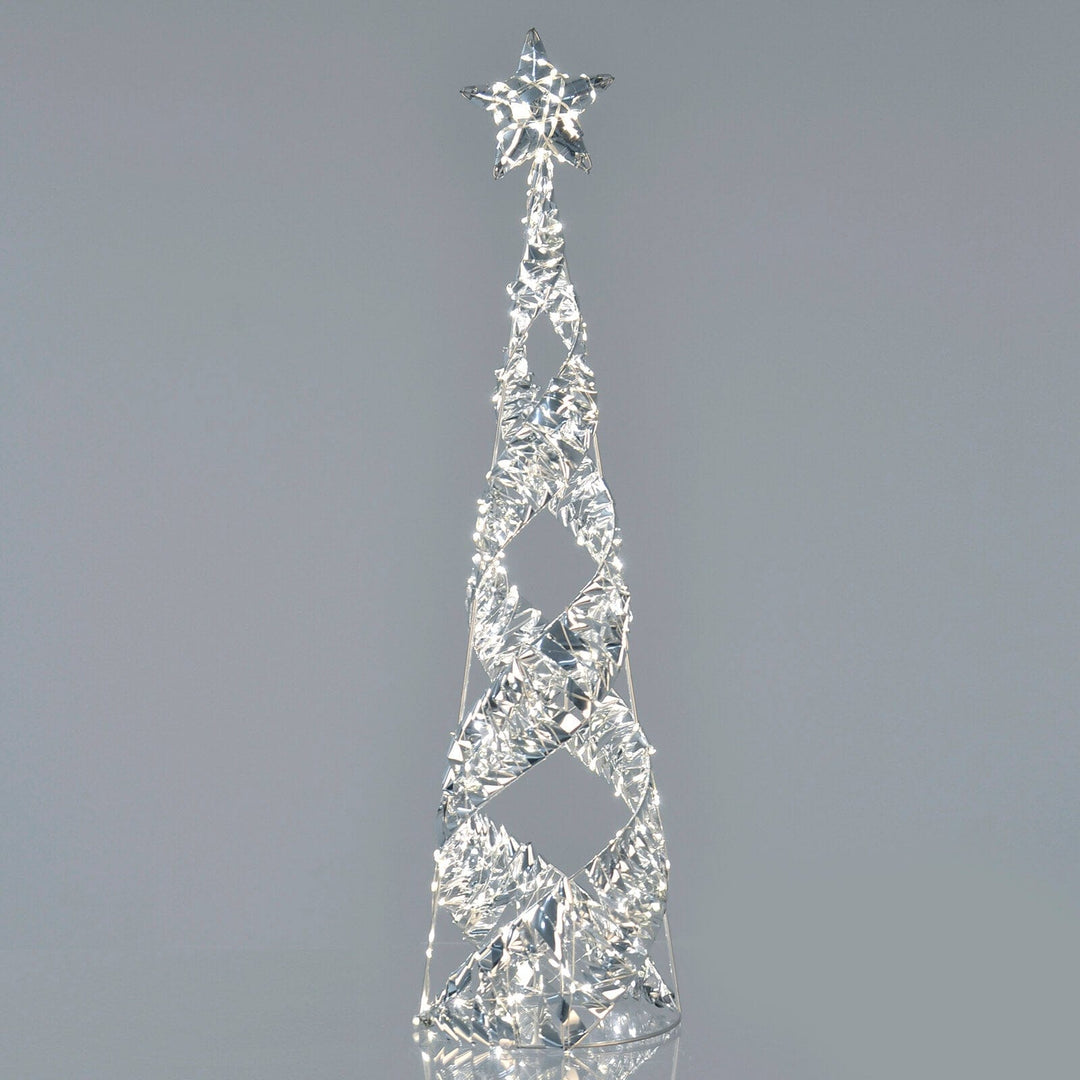 Silver foil spiral light up Christmas tree on grey background