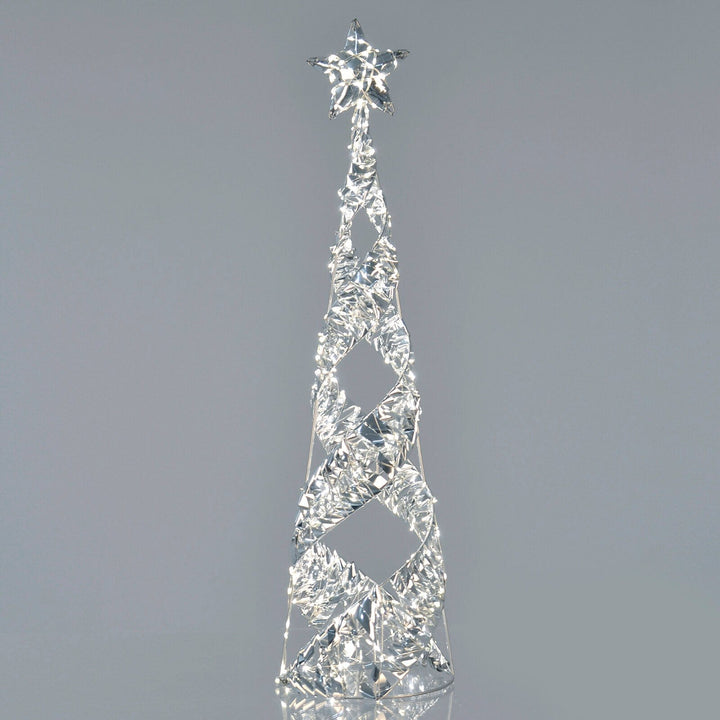 Silver foil spiral light up Christmas tree on grey background