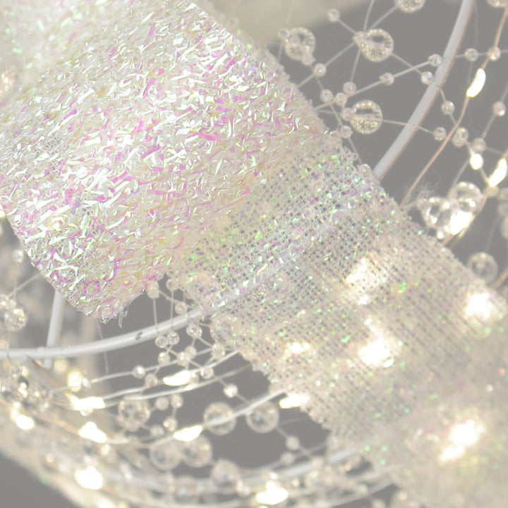 Close up of iridescent ribbon on  beaded gift box Christmas decoration