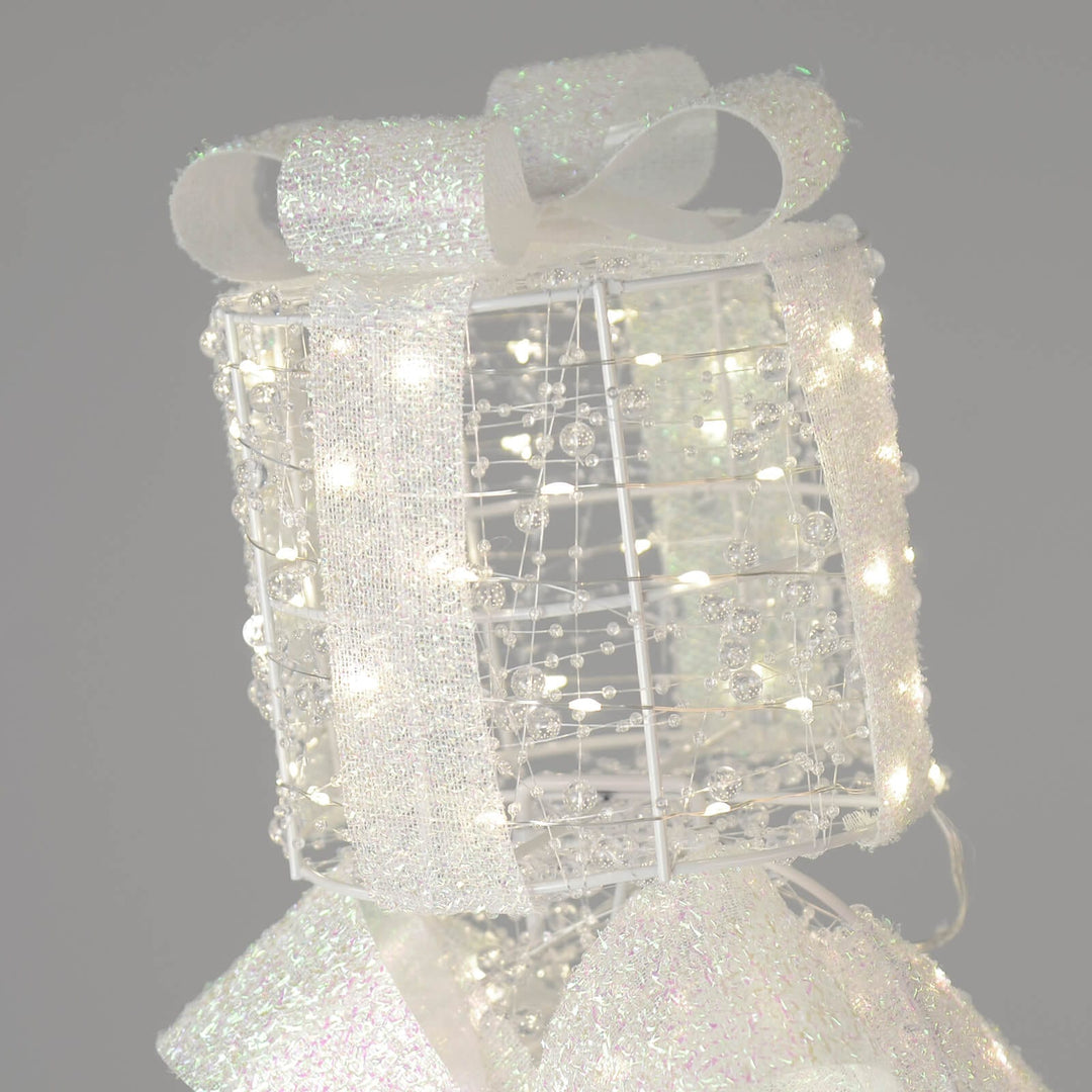Gift box light up Christmas decoration at the top of a stack of 3 with LED lights 