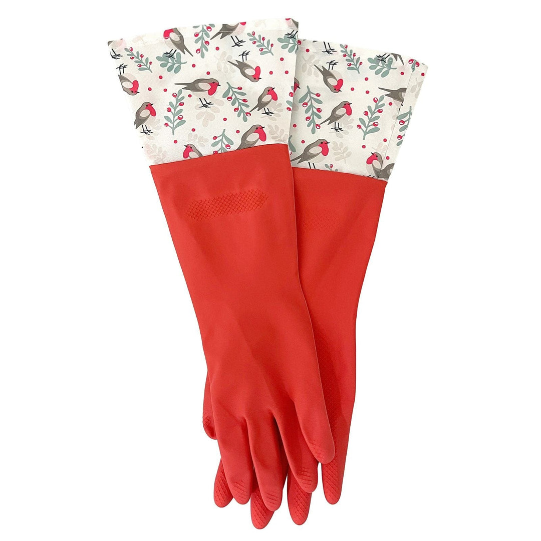 Red rubber cleaning gloves with patterned cuffs featuring christmas robins, holly and berry leaves on a white background
