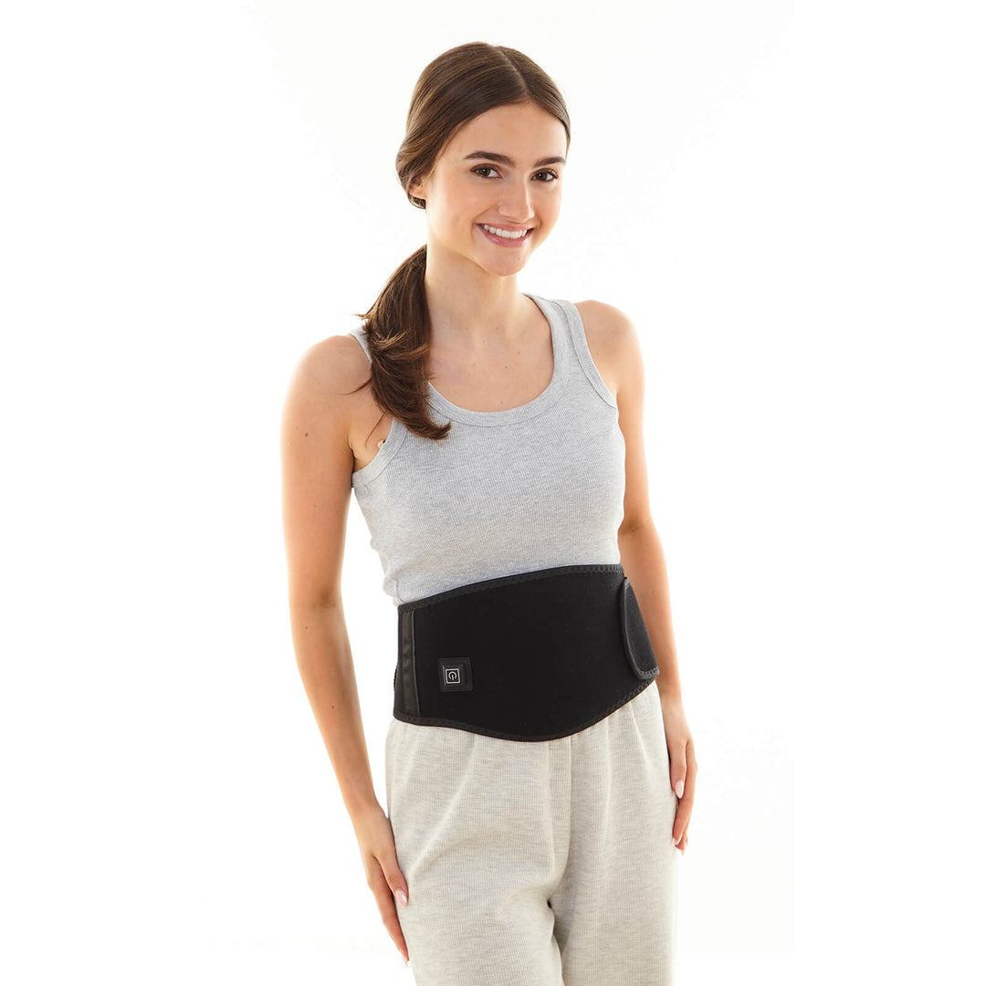 Woman wearing leisure clothes and a waist heat belt