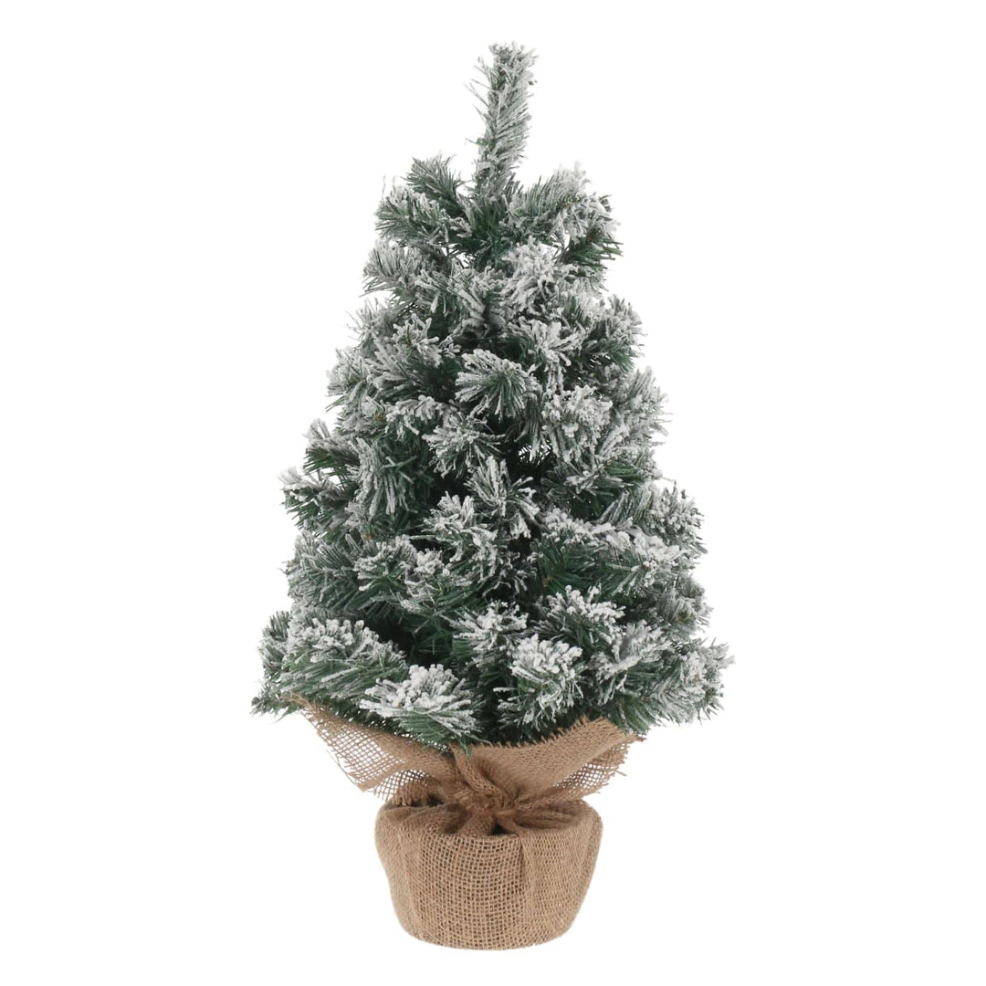 Frosted artificial mini Christmas tree in a pot with a jute cover on a white background