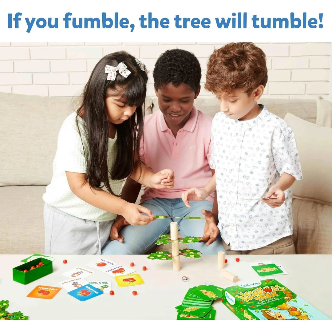Three children playing with a Newton's Tree game with text 'If you fumble, the tree will tumble!'.