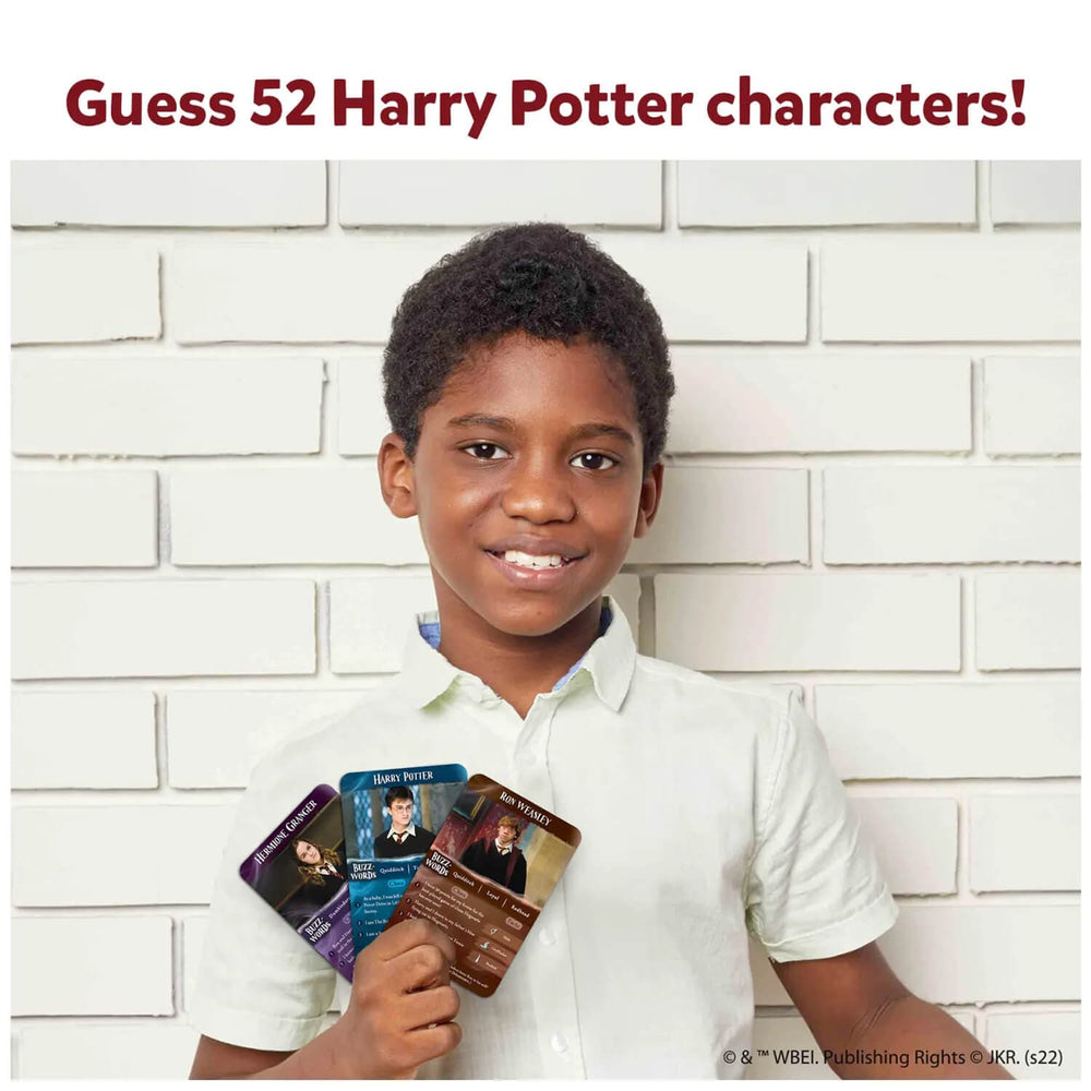 Boy holding 3 Harry Potter cards from a guess in 10 game