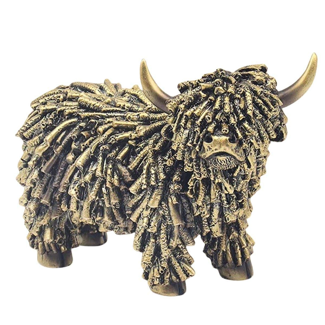 Bronze sculpture of a highland cow on a white background