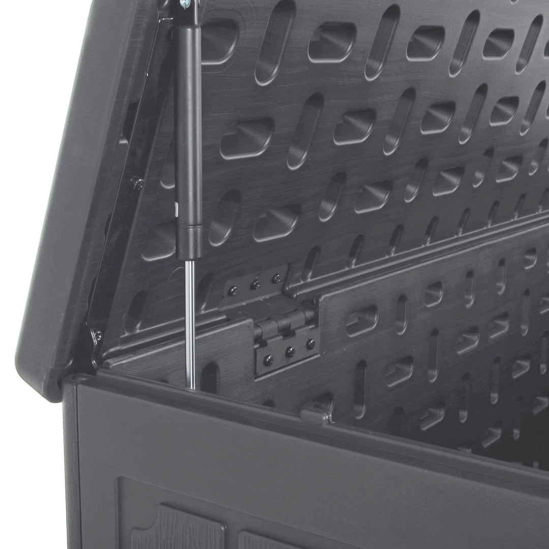 Close up of a gas assist hinged lid on a grey deck box