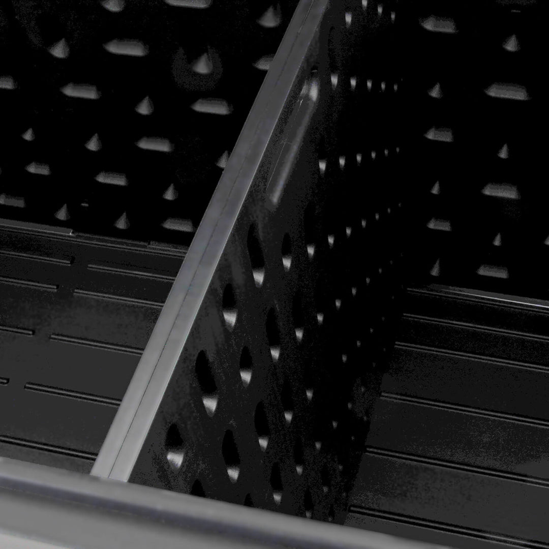 Inner divider of a dark grey deck box for outdoor storage