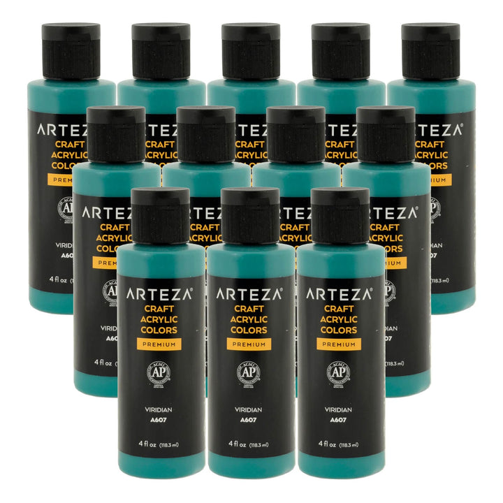 12 bottles of blue green acrylic paint on a white background