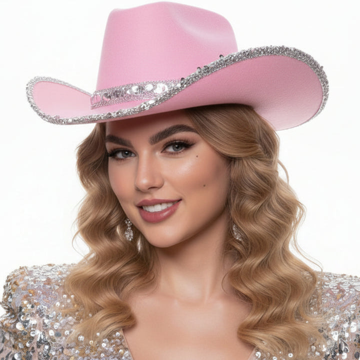 Woman wearing a baby pink cowboy hat with silver sequins