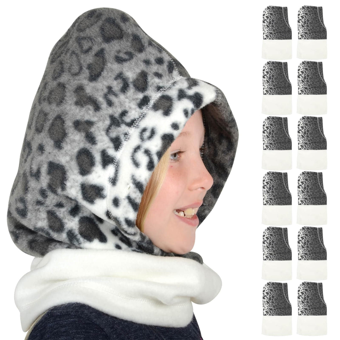 Child wearing a snow leopard print hood