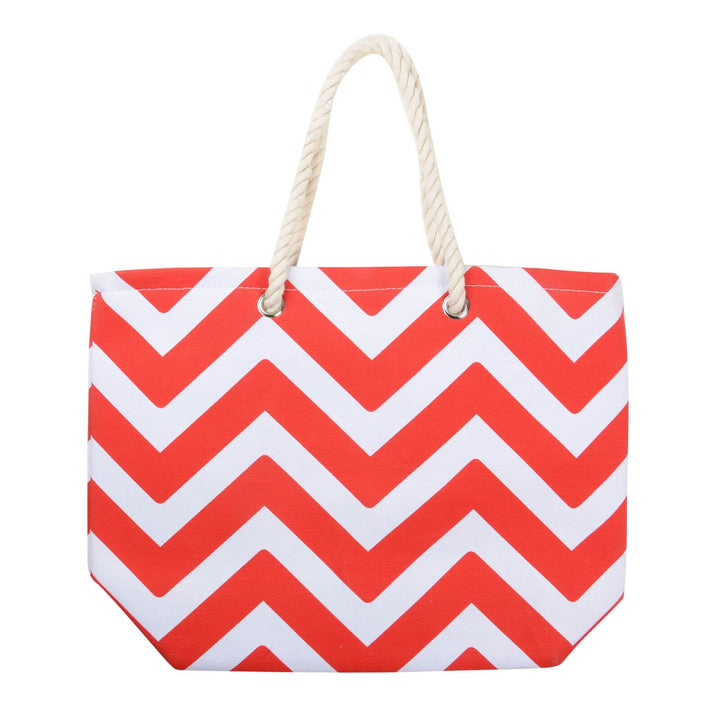 Red and whte chevron pattern beach bag with white rope handles on a white background