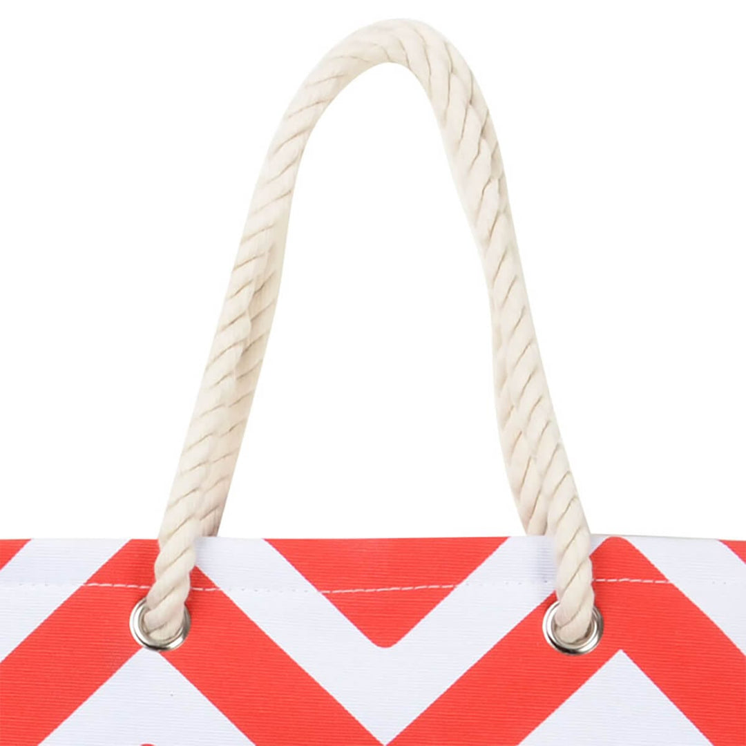 Close up white rope handles on a red chevron tote bag on a white background