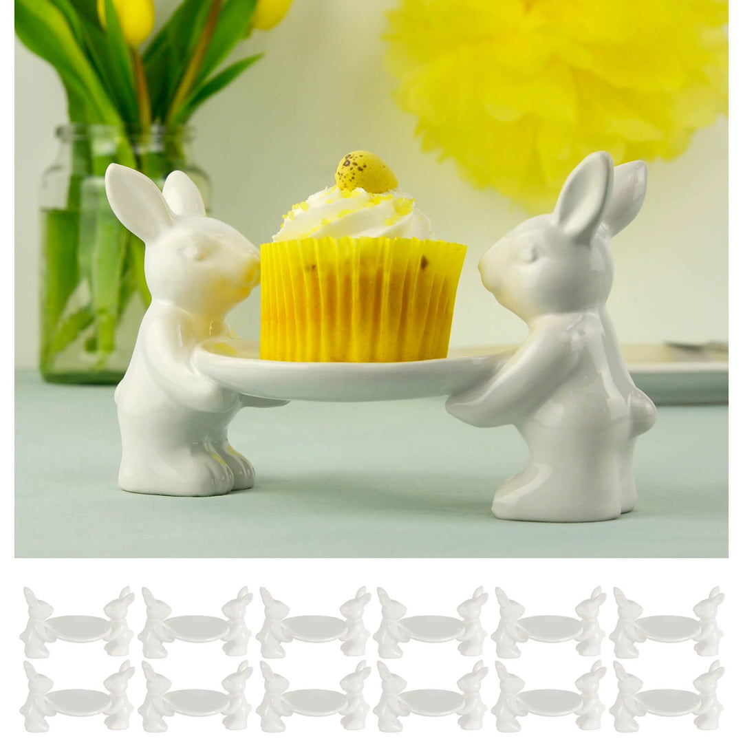 White ceramic bunny-shaped cake plate with an Easter cupcake on a light green background