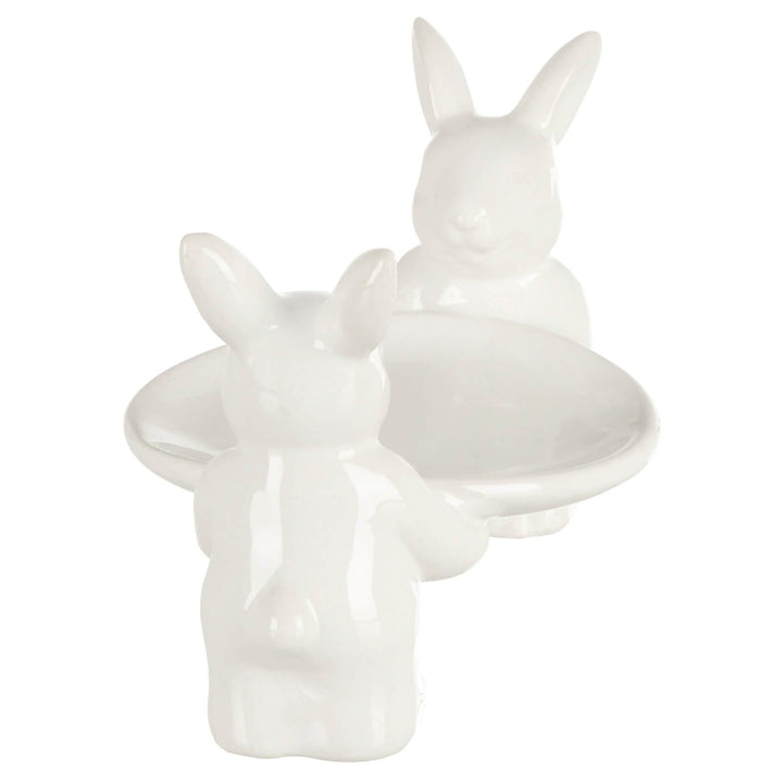 White ceramic Easter rabbit cake stand on a white background