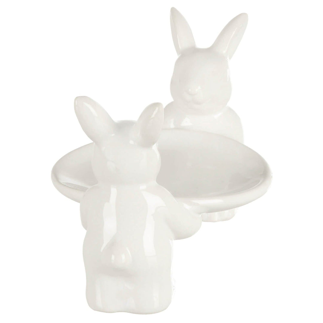 White ceramic Easter rabbit cake stand on a white background