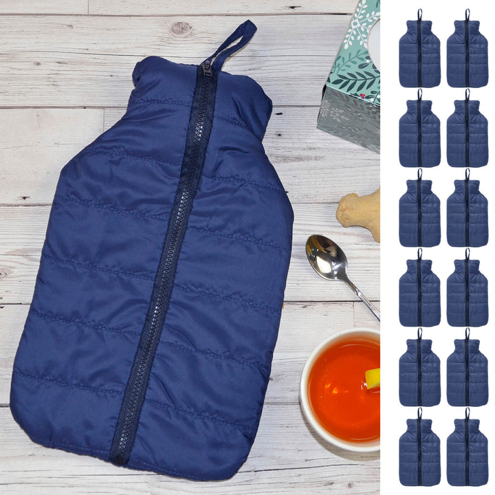 Navy puffer jacket cover on a hot water bottle on a white table with 12 small hot water bottles down the side