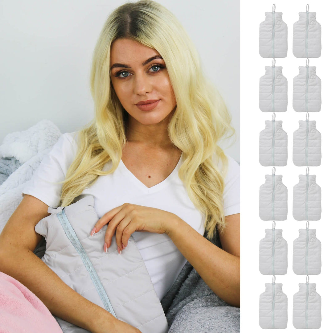 Woman holding a light grey padded hot water bottle with 12 small hot water bottles down the side