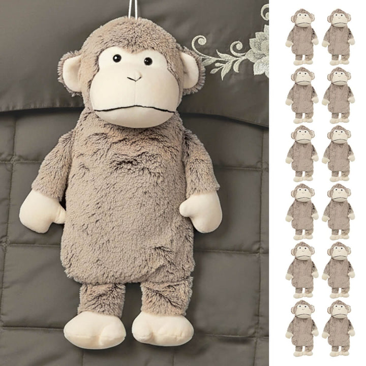 Monkey hot water bottle with plush 3D cover on a bed