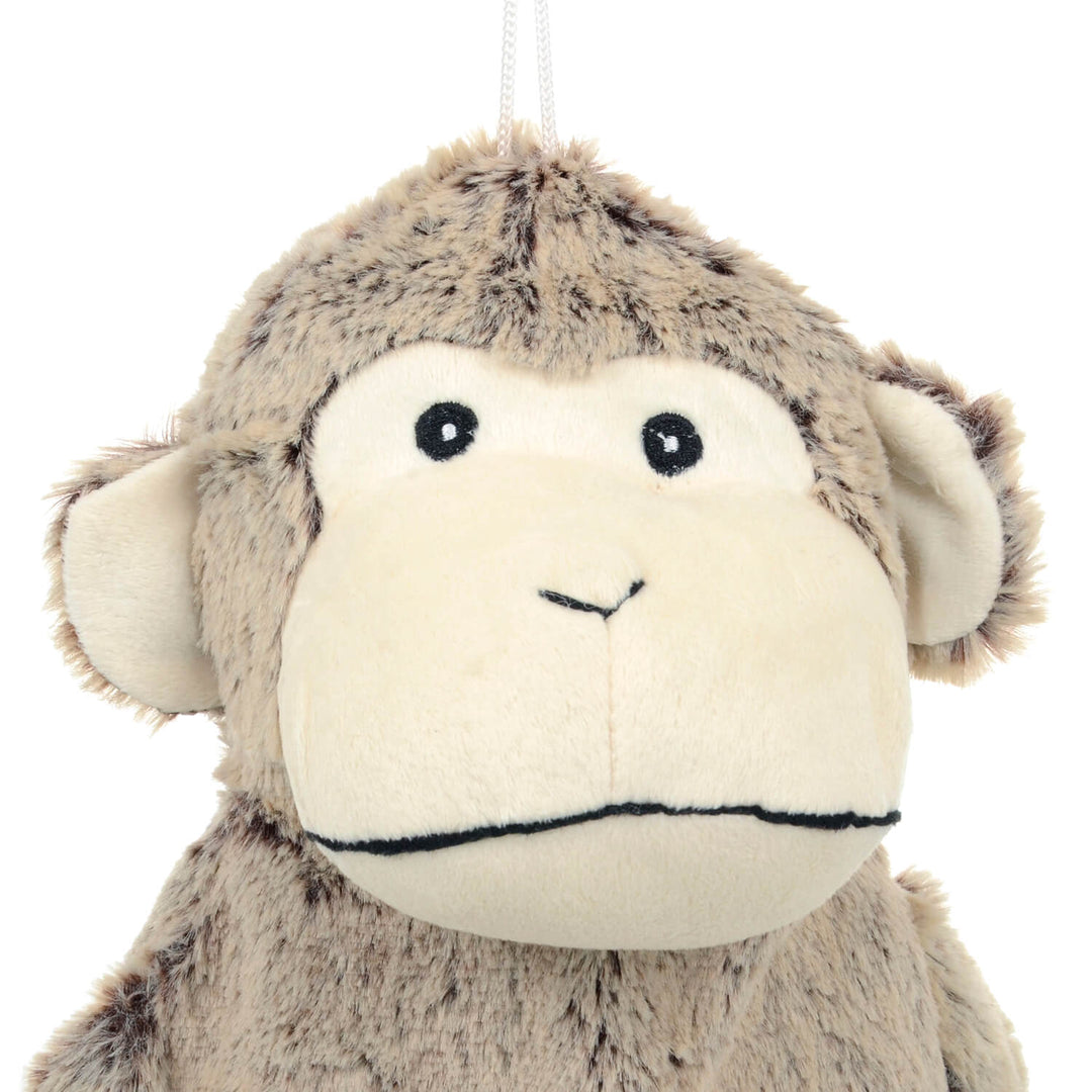 Close up of athe head of a plush monkey hot water bottle cover