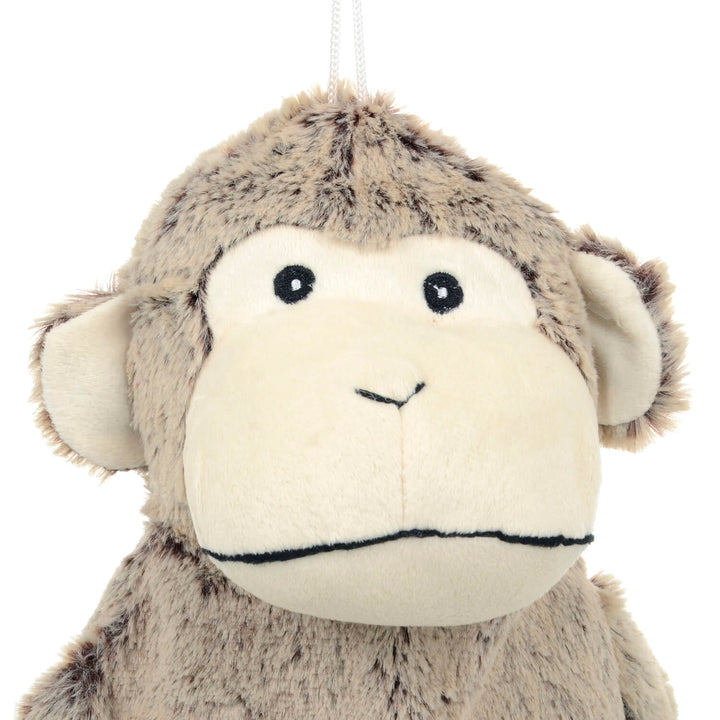 Close up of athe head of a plush monkey hot water bottle cover