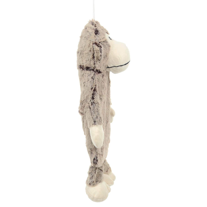 Side view of a padded plush monkey hot water bottle cover on a white background