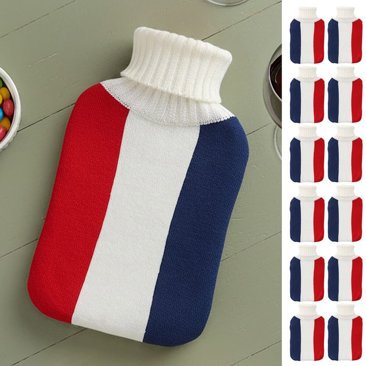 Red white and blue French flag hot water bottle on a sage green wooden table with 12 smaller hot water bottles down the side