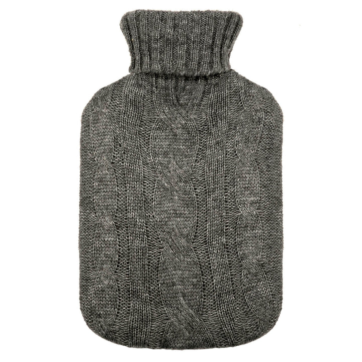 Hot water bottle with a dark grey cable stitch pattern knitted cover